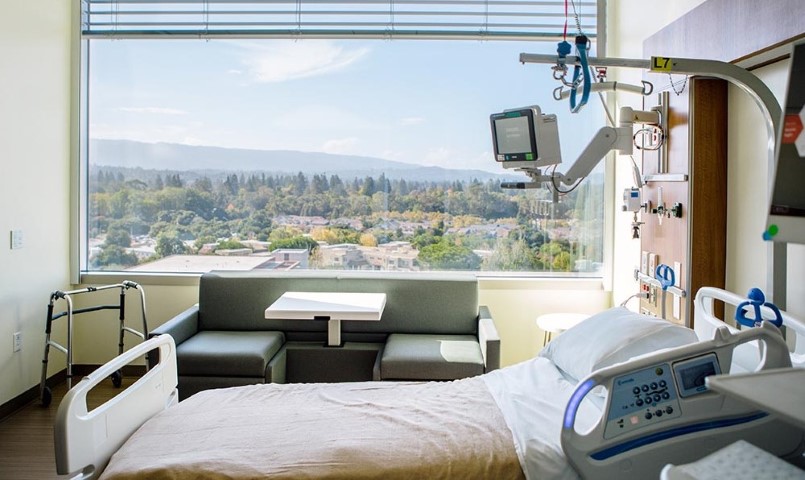 Empty patient room with beds